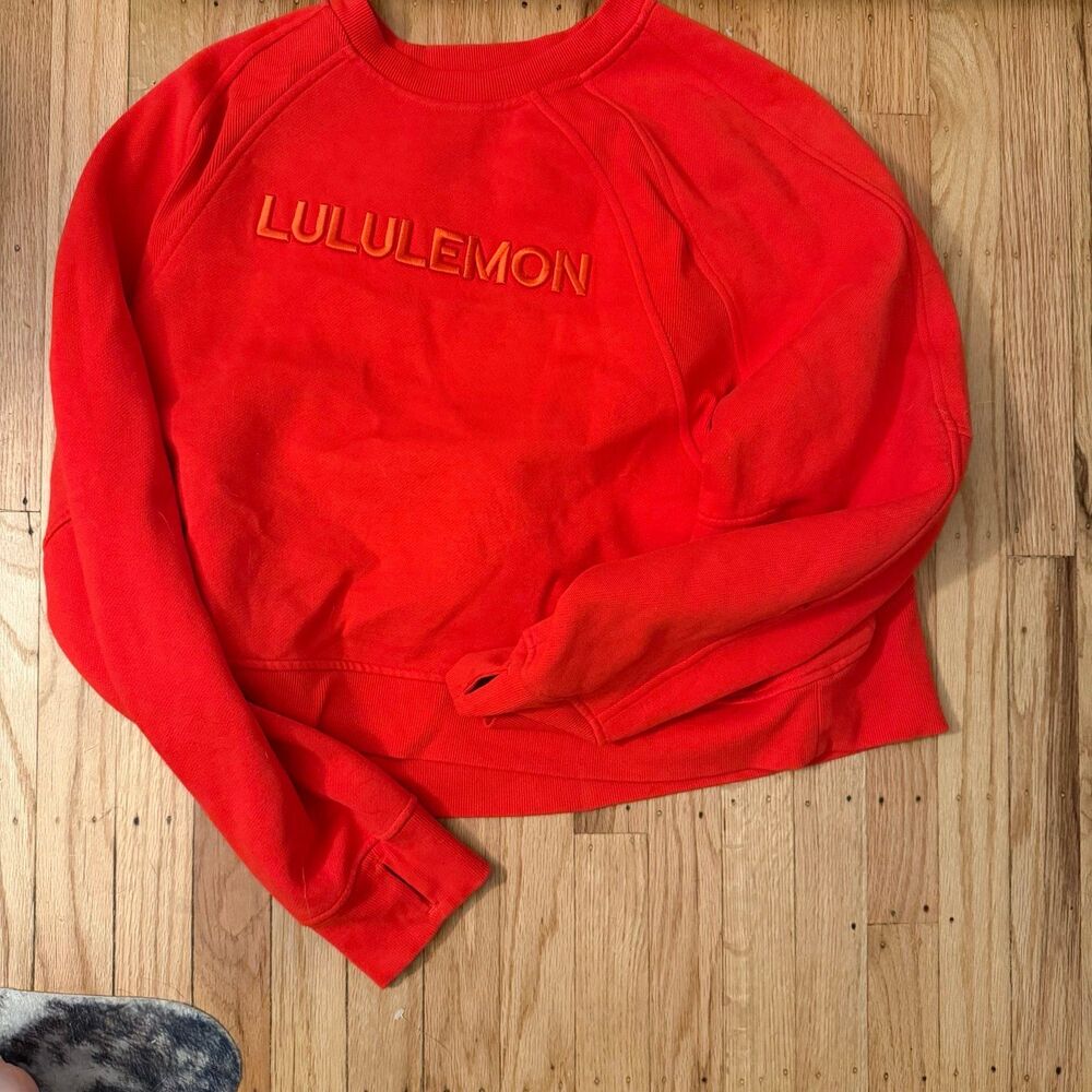 Red lululemon word marked scuba pullover
